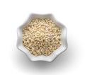 Heap of pearl barley in a bowl on white.