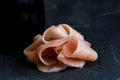 Heap of pickled pink ginger slices isolated on black slate next