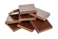 Heap of pieces of chocolate isolated on white Royalty Free Stock Photo