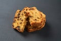 Heap of pieces of tasty sweet homemade bread with raisin lies on dark concrete table on kitchen Royalty Free Stock Photo