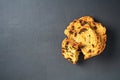 Heap of pieces of tasty sweet homemade bread with raisin lies on dark concrete table on kitchen Royalty Free Stock Photo