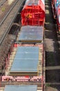 Heap pile heavy raw rusted steel iron sheet plates loaded on railroad cargo freight carriage. Metal goods factory plant