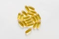 Heap pills of black cumin seeds essential oil Nigella Sativa on white background Royalty Free Stock Photo