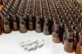 Heap of pills with empty medicine containers, pharmaceutical industry concept