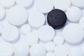 Heap of pills tablets medicine lying isolated on black background extreme close-up Royalty Free Stock Photo