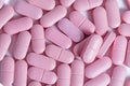Heap of pink pills on white background Royalty Free Stock Photo