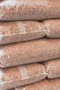 Heap of plastic bag with wooden pellets Royalty Free Stock Photo
