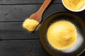 Heap of Polenta or Cornmeal Flour in a white bowl. Ground Dried Corn or Corn Grits. Top View, Copy Space. Healthy Grains Royalty Free Stock Photo