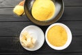 Heap of Polenta or Cornmeal Flour in a white bowl. Ground Dried Corn or Corn Grits. Top View, Copy Space. Healthy Grains Royalty Free Stock Photo