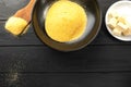 Heap of Polenta or Cornmeal Flour in a white bowl. Ground Dried Corn or Corn Grits. Top View, Copy Space. Healthy Grains Royalty Free Stock Photo