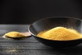 Heap of Polenta or Cornmeal Flour in a white bowl. Ground Dried Corn or Corn Grits Royalty Free Stock Photo