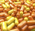 Heap, pool of vitamin pills with orange and lemon surface, medicine tablets Royalty Free Stock Photo