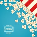 Heap popcorn for movie lies on blue background.