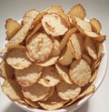 Heap of potato chips isolated on white background