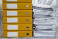 Heap of project drawings in yellow folder. Royalty Free Stock Photo