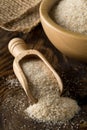 Heap of psyllium husk also called isabgol in wooden scoop and bowl on table Royalty Free Stock Photo