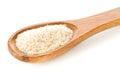 Heap of psyllium husk also called isabgol in wooden spoon over white background Royalty Free Stock Photo