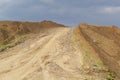 heap in the quarry sand against the blue sky. Belarus