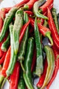 Heap of red and green hot chilli peppers close up. color contrast Royalty Free Stock Photo