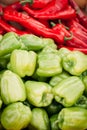 Heap of red hot chilli and green peppers close up. Background from a peppers. texture of heap of peppers beautiful shiny, overhead Royalty Free Stock Photo