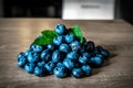 Heap of ripe blueberries with mint leaves Royalty Free Stock Photo