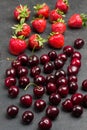 Heap of ripe cherries and strawberry on table Royalty Free Stock Photo