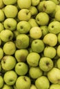 Heap of ripe green apples in a box. Vitamins and healthy food. New harvest. Top view. Vertical Royalty Free Stock Photo