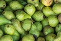 Heap of Ripe Organic Green Pears in Wooden Box at Farmers Market. Bright Vibrant Colors. Vitamins Superfoods Healthy Diet