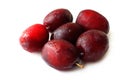 Heap Ripe plums on white background