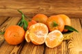 Heap of ripe tangerine mandarin fruits on old wooden background