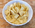 Heap of rippled chips in bowl