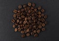 Heap of roasted coffee beans on black background Royalty Free Stock Photo