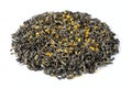 A heap of rolled green tea leaves with sweet dried osmanthus flower. Traditional oxidized Chinese tea