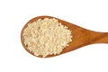 Heap of rolled oats with wooden spoon