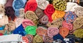 Heap of rolled towels and blankets with different patterns and designs Royalty Free Stock Photo