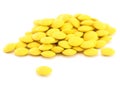 Heap of round yellow pills