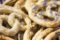 Heap of salted pretzels or cookies with sesame and chia. Concept of unhealthy food Royalty Free Stock Photo