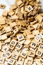 Heap of scrabble tile letters from above