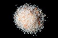 Heap of sea coarse salt on a black background. Royalty Free Stock Photo