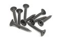 Heap of several steel screws on a white background Royalty Free Stock Photo