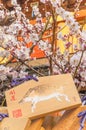 Heap of shinto wooden Ema plaques under the plum trees in bloom in the Yushima Tenmangu Shrine