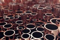 Heap of shiny copper pipes with selective focus effect. 3d rendering