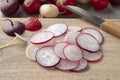 Heap of sliced fresh colorful radish close up on a cutting board Royalty Free Stock Photo