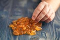 Heap of softgel fish oil in man hands