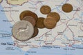 Heap of South African Rand coin money on on the map. Concept of finance or travel