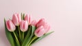 heap of tulips on pink pastel color background with copy space