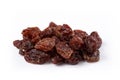Heap of sultana raisins on white