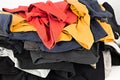 Heap of t-shirts. serigraphy production. printing images on tshirts in a design studio. selective focus photo