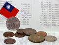 Heap of Taiwan dollars coin money and mini Taiwan flag on the book bank. Concept of Saving money