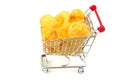 Heap of tasty crisp potato chips, snack in metal trolley, cart isolated on white background